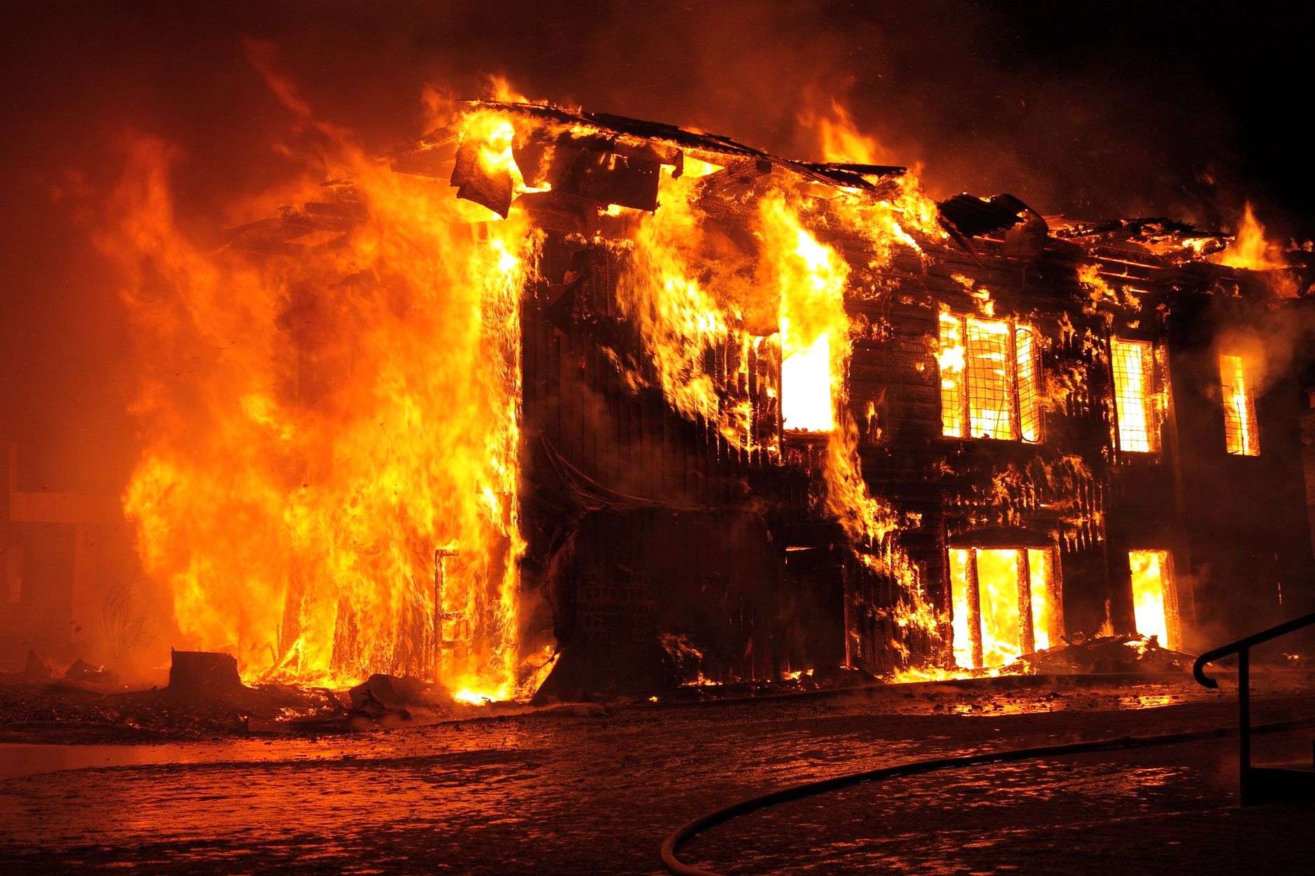 Firefighters responding to a residential structure fire