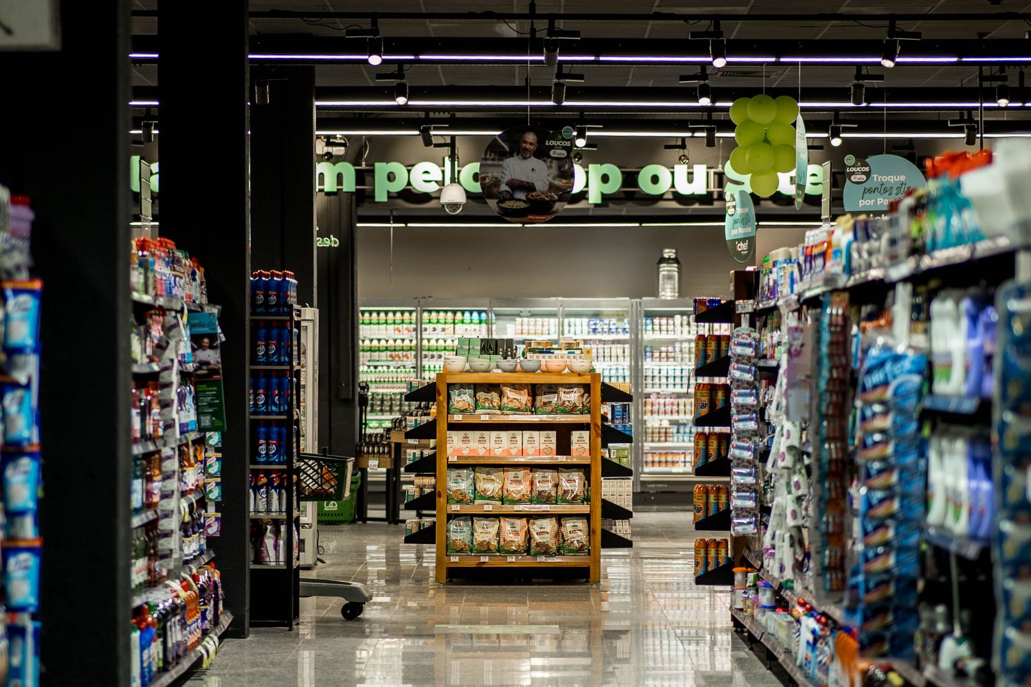 Aisle inside a grocery store with stocked shelves