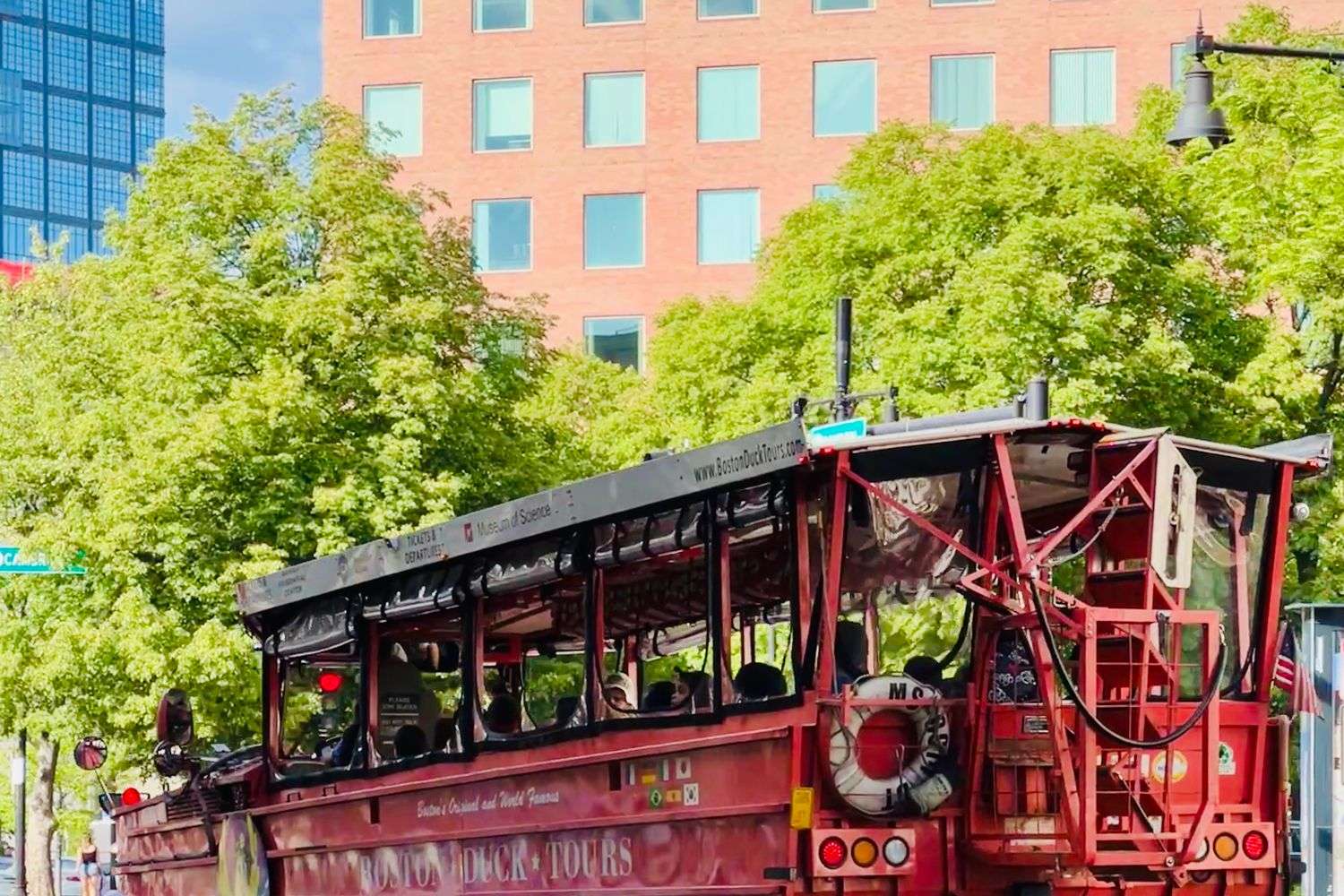 An amphibious duck boat tour vehicle traveling on the water