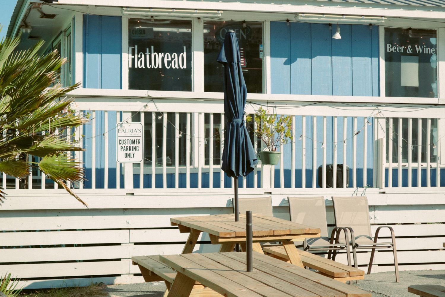 Retail storefronts along a busy Gulf Shores, Alabama roadway