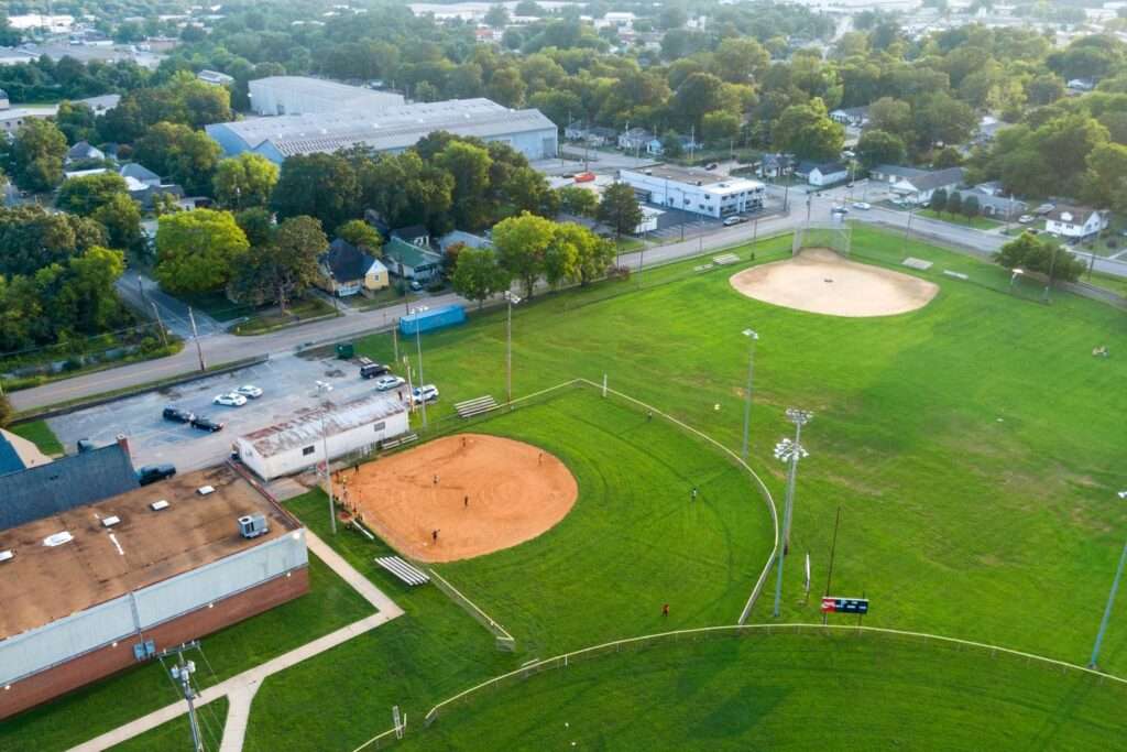 Aerial view of a baseball diamond and outfield with players on the field
