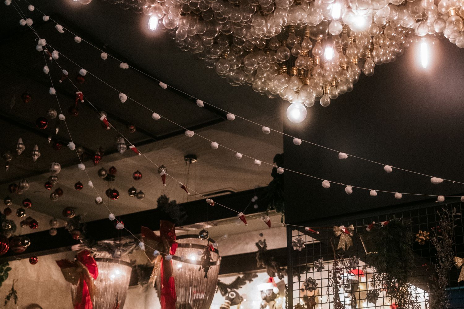 A downtown bar glows with Christmas decorations during a holiday celebration