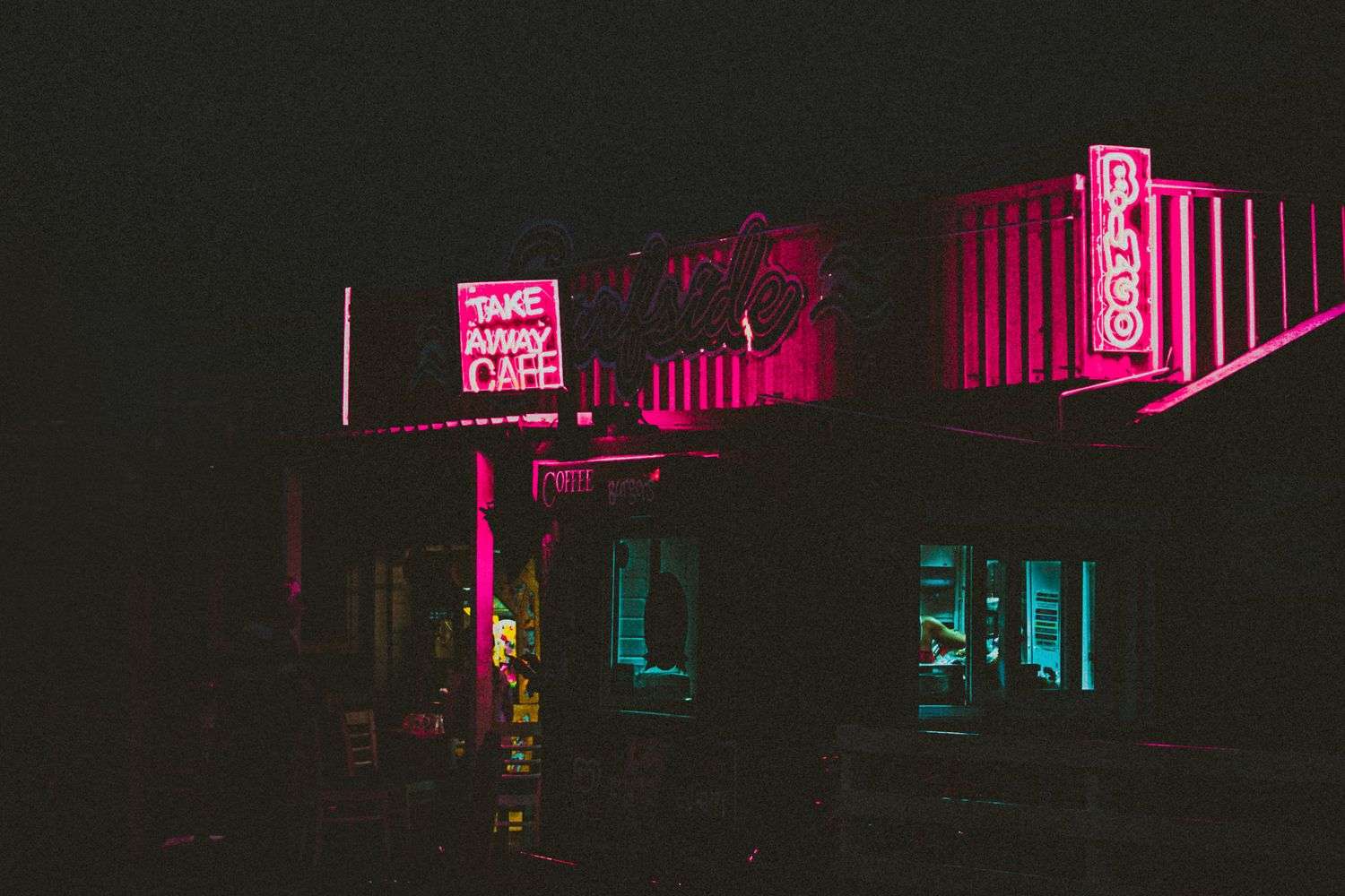 The pink storefront of a downtown Mobile bar
