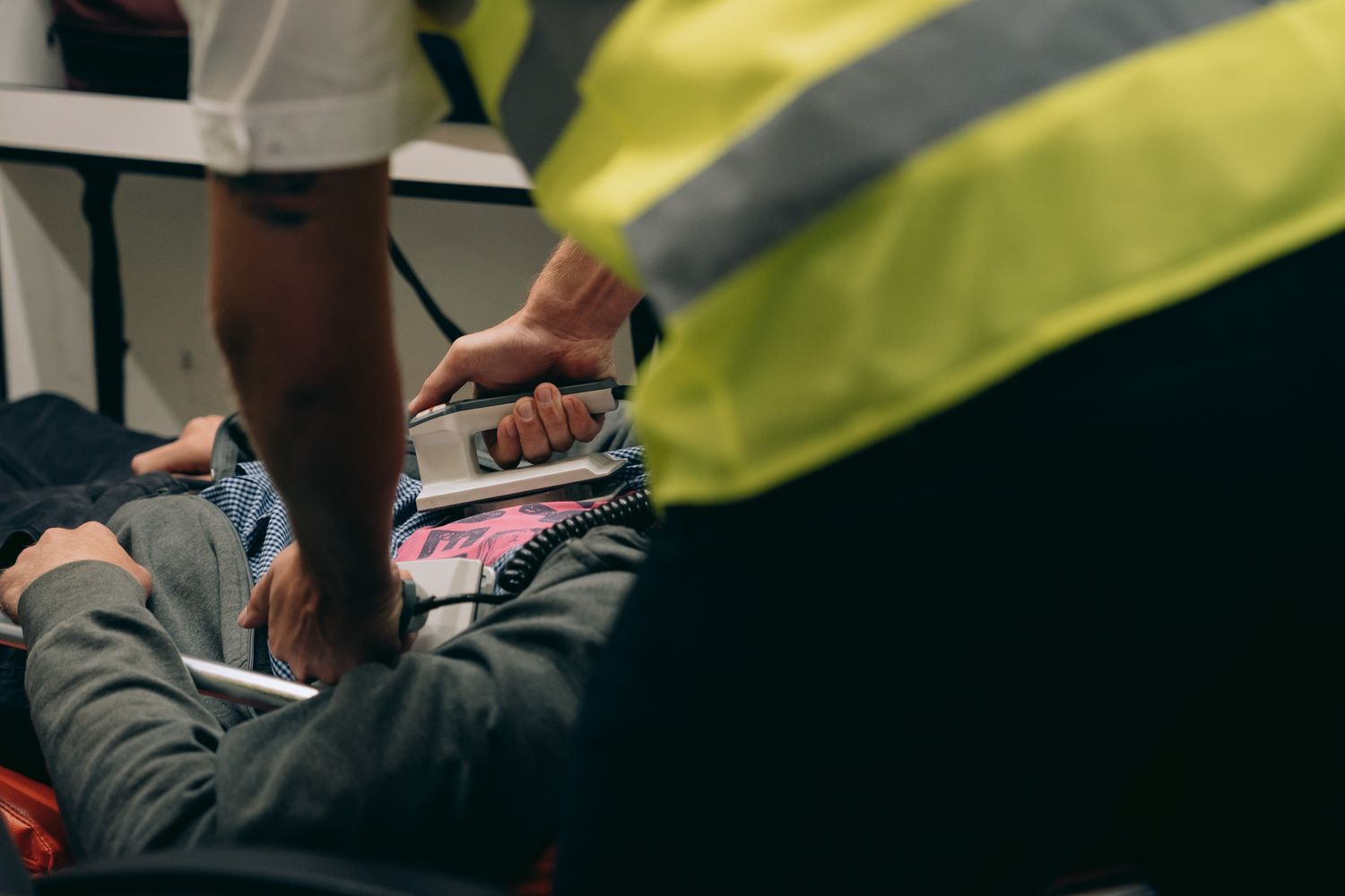 Doctors and nurses treating a patient in a hospital emergency room