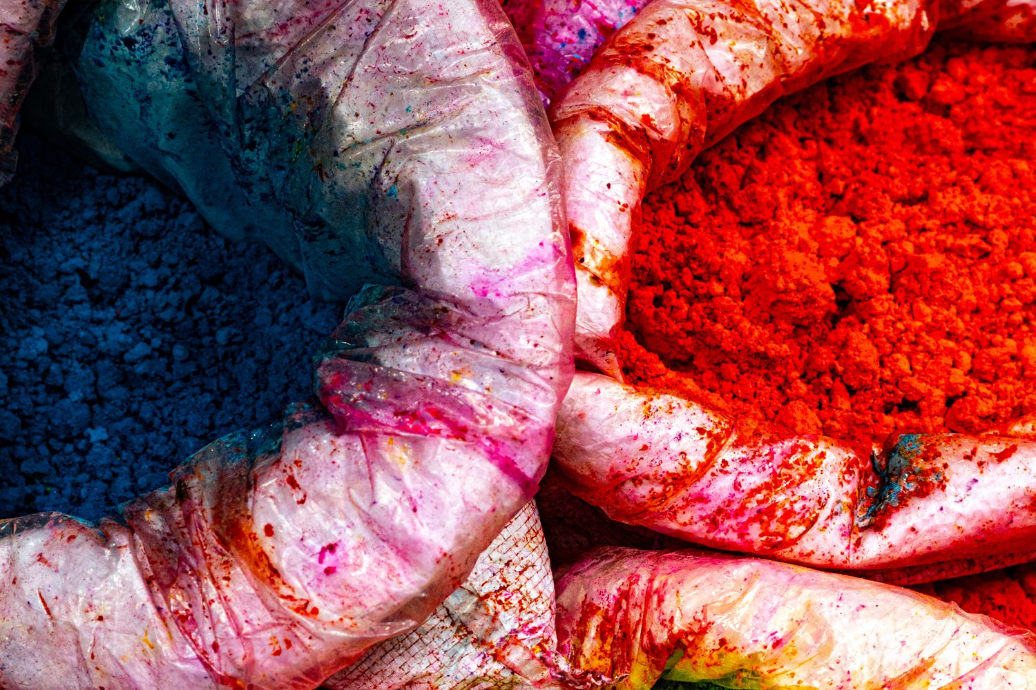 Crowd celebrating the Holi festival of colors with colored powder