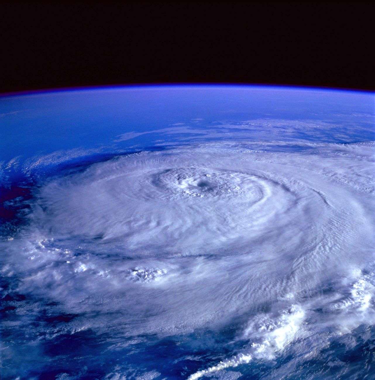 Satellite image showing a large rotating hurricane storm system