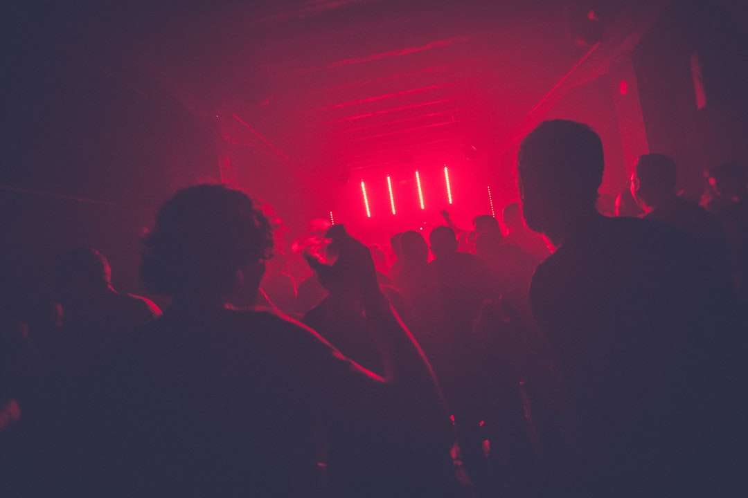 Interior of a renovated bar and nightclub with colorful stage lighting