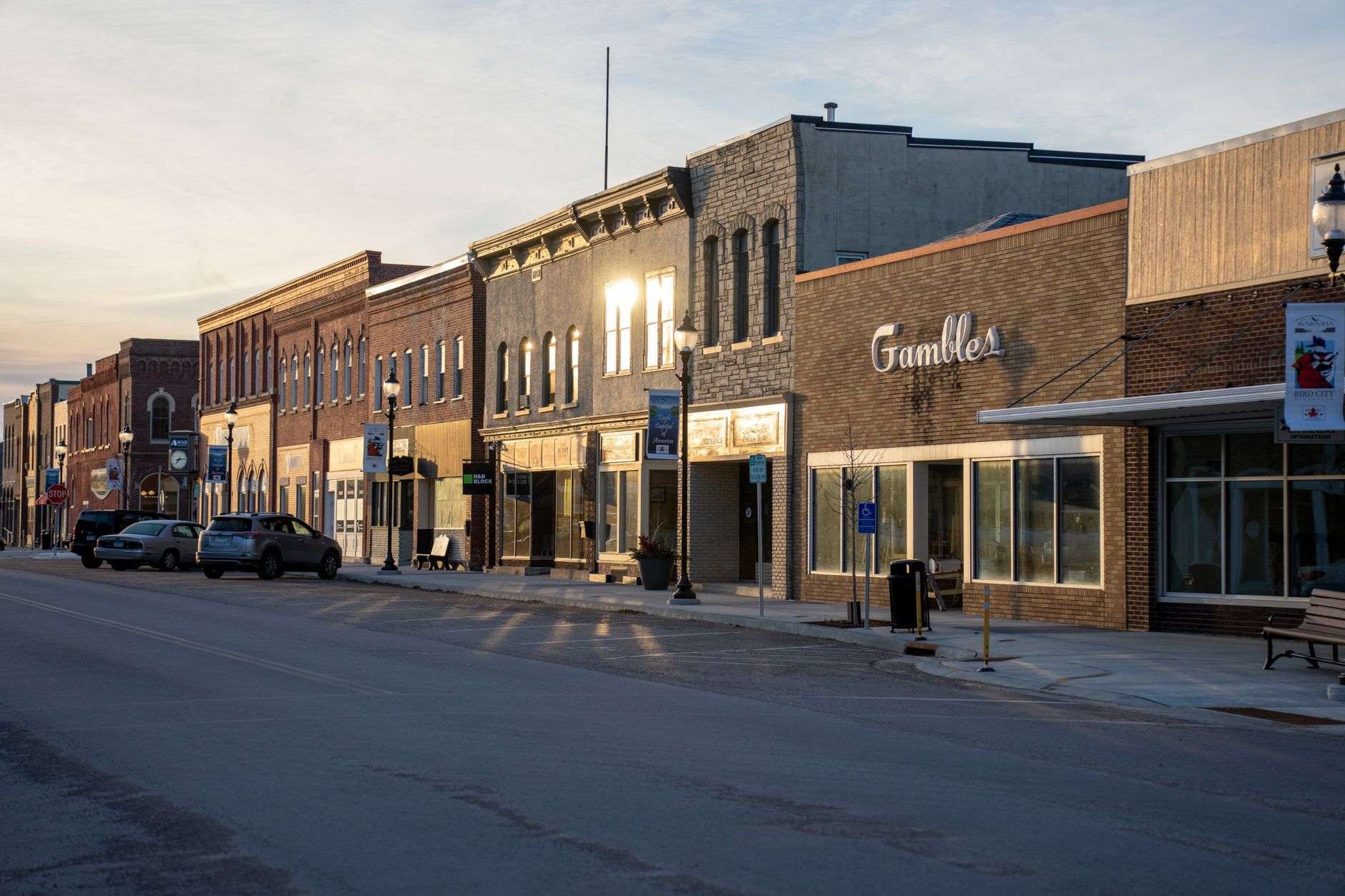 Historic downtown storefronts in a small riverside town similar to the proposed Milton Mill District