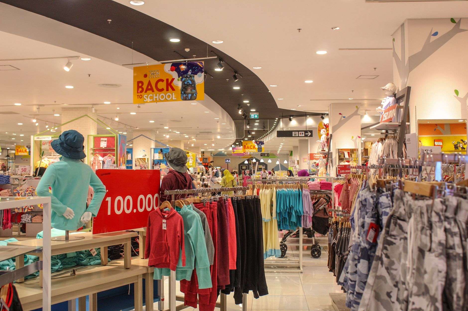 Store aisle stocked with back-to-school clothing and supplies during Florida's sales tax holiday