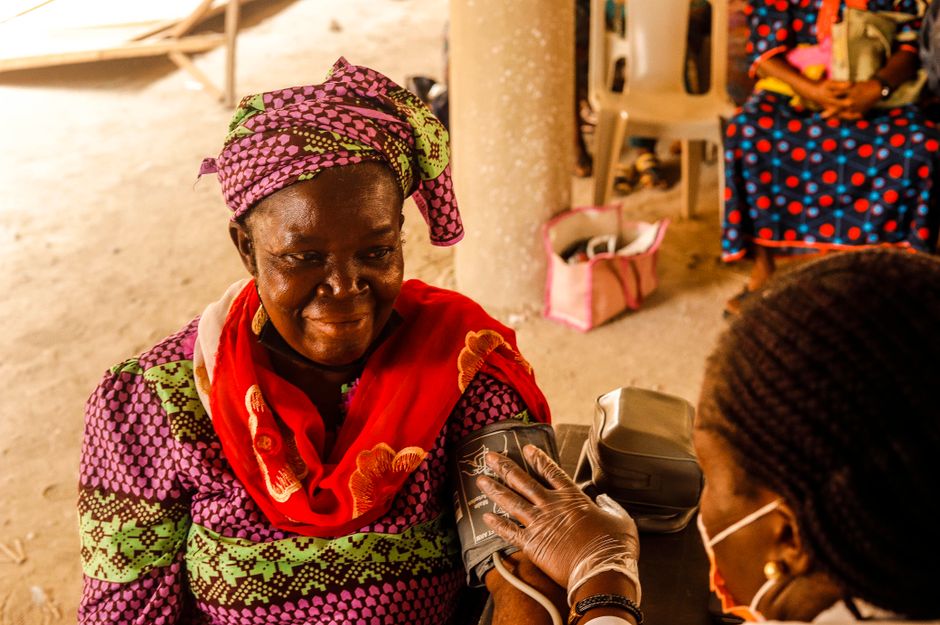 Healthcare provider talking with a patient in a clinic