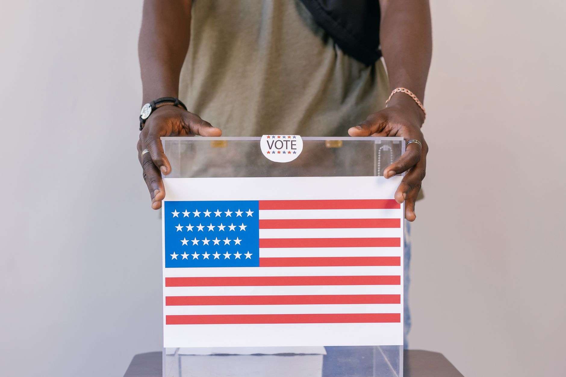 American flag with election vote signage