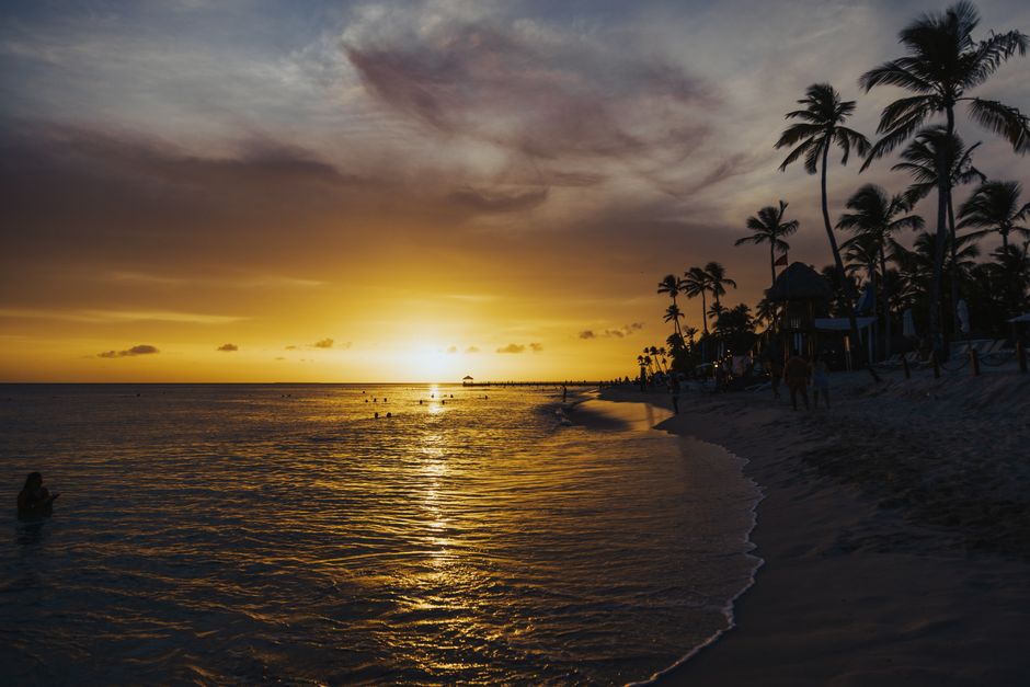Tropical beach at sunset with palm trees on the Gulf Coast