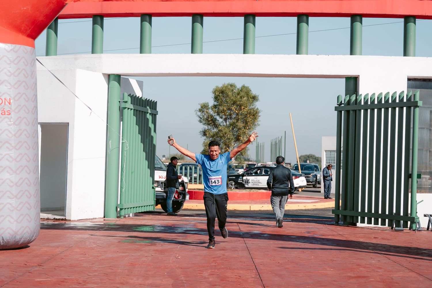 Runner crossing the finish line of a road race