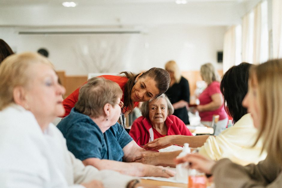 Older adults socializing together at a community senior center