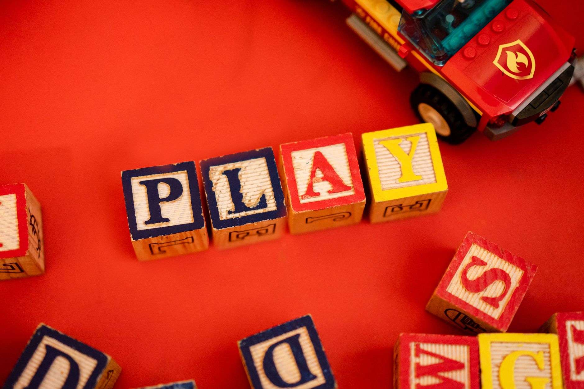 Children playing with building blocks at a library activity room