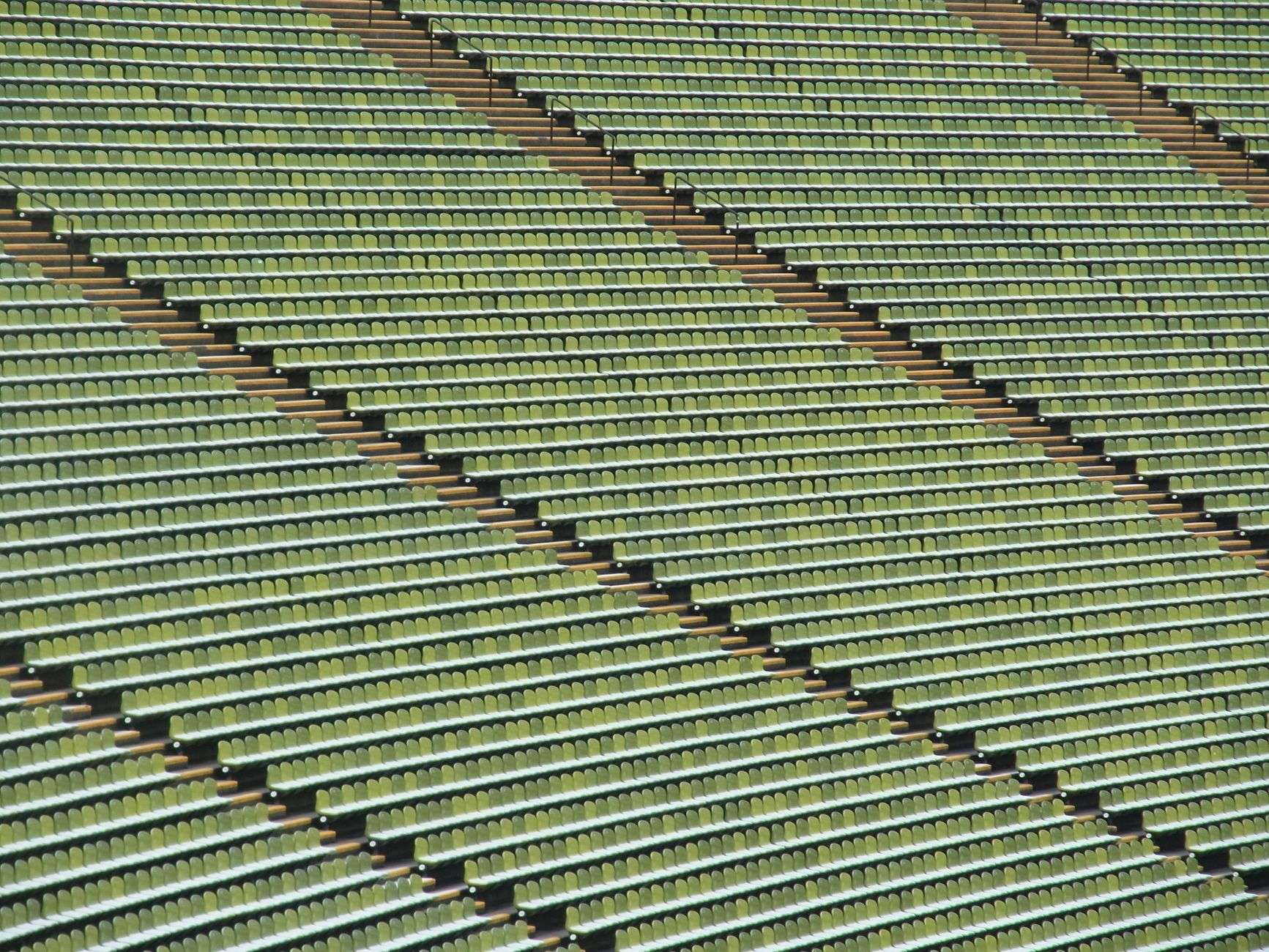 Empty bleachers and lights inside a football stadium