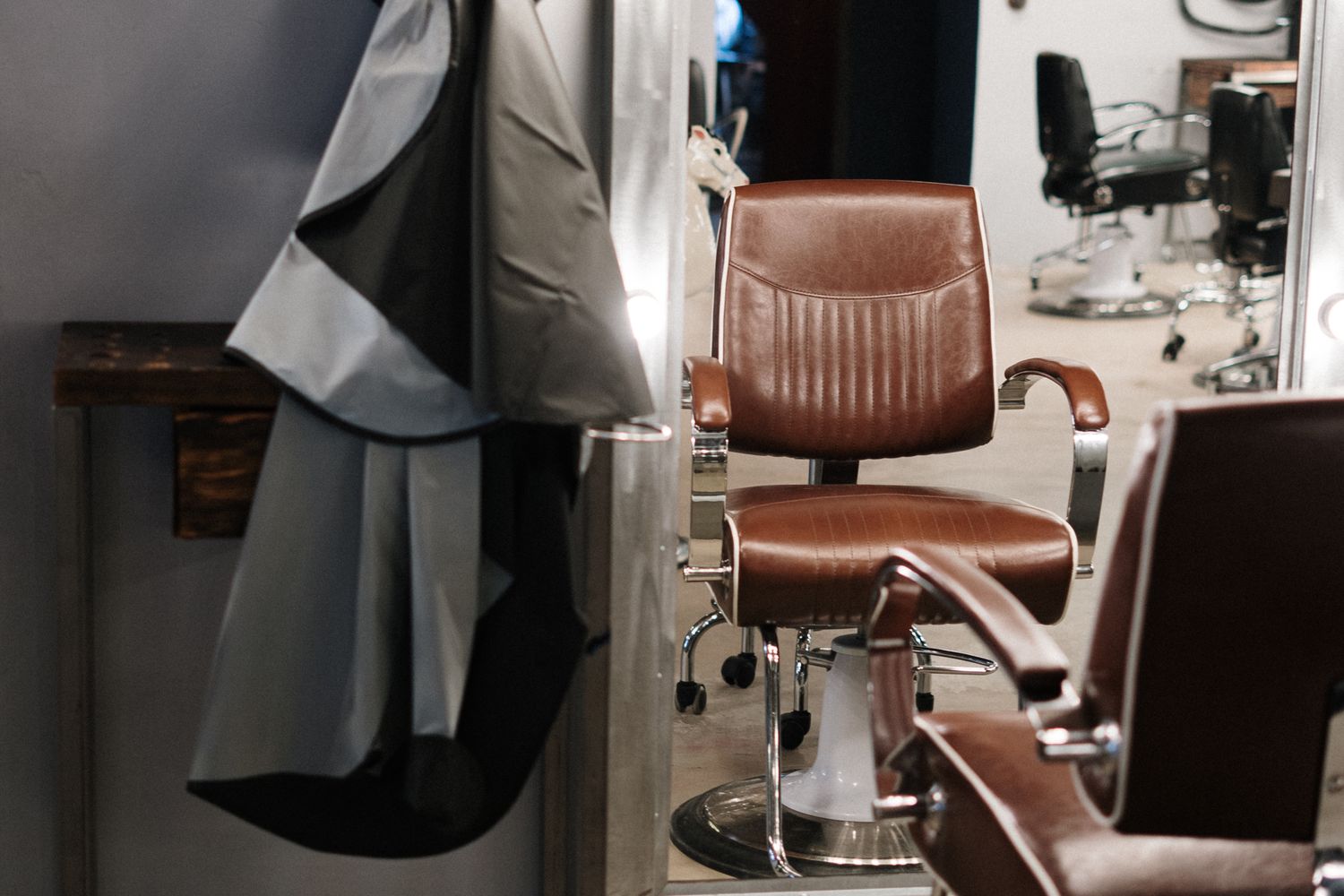 Styling chairs and mirrors inside a small hair salon