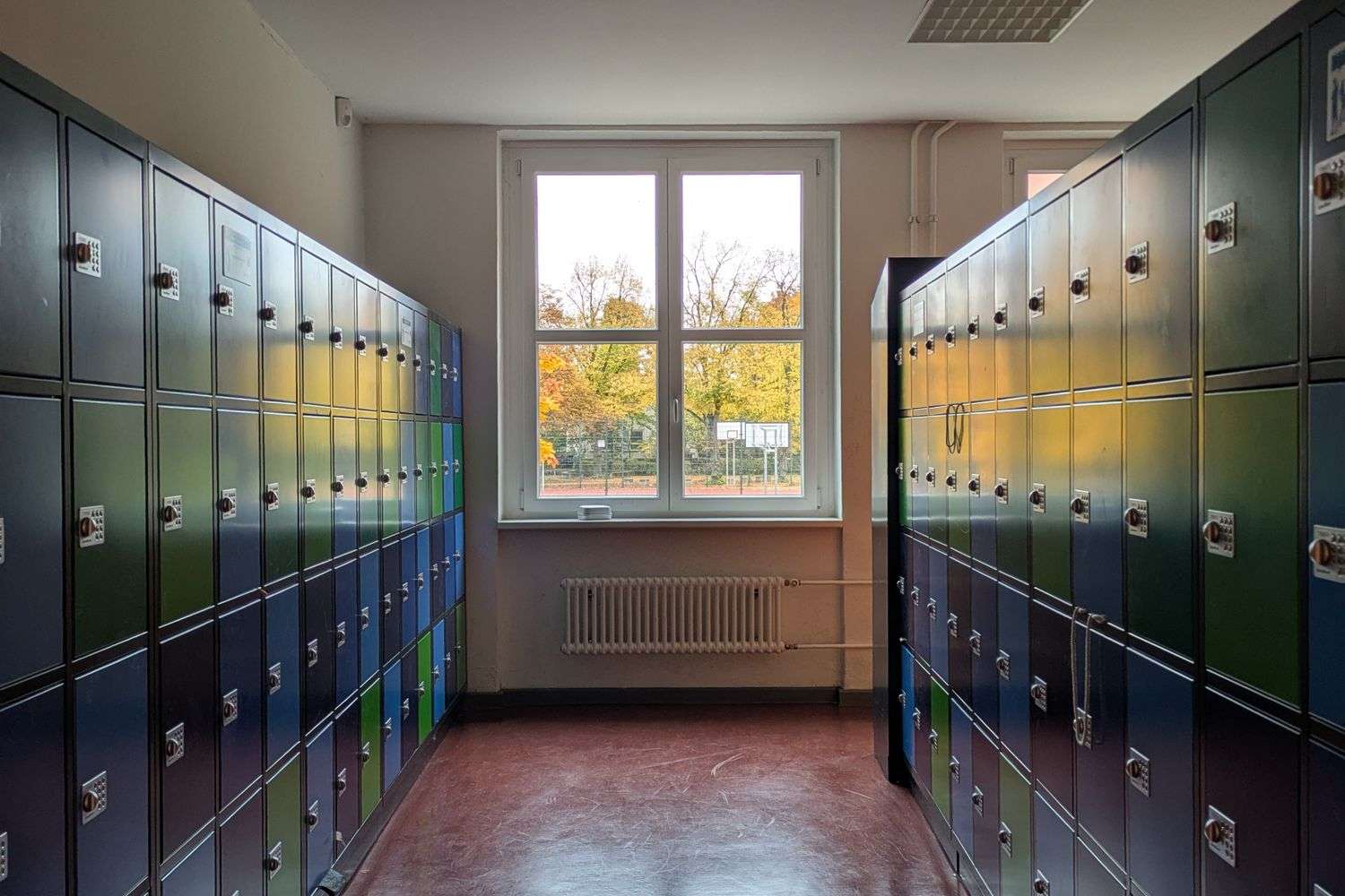 Empty elementary school hallway lined with lockers