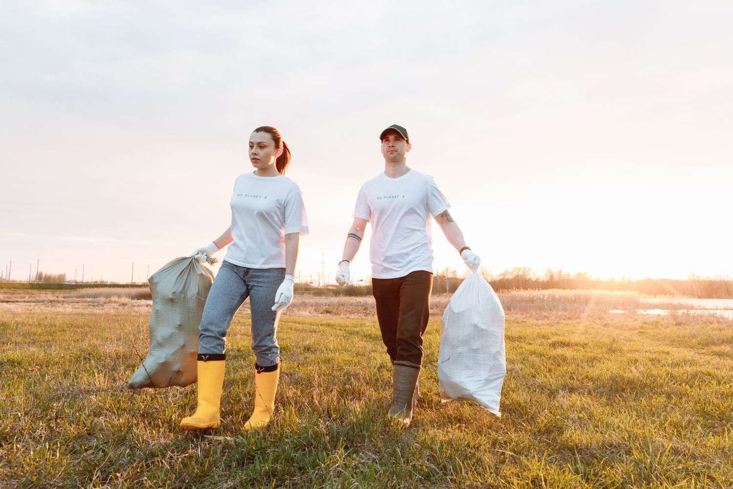 Volunteers picking up litter along a road
