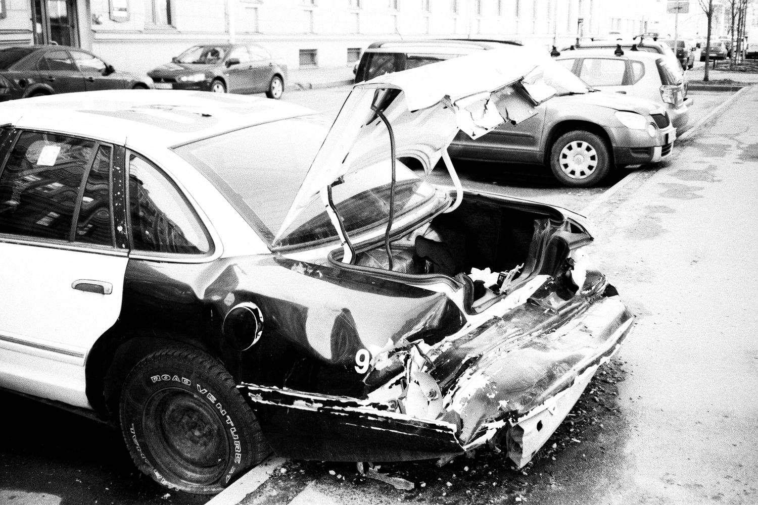 Gold sedan that crashed into the wall of a Mobile photography studio