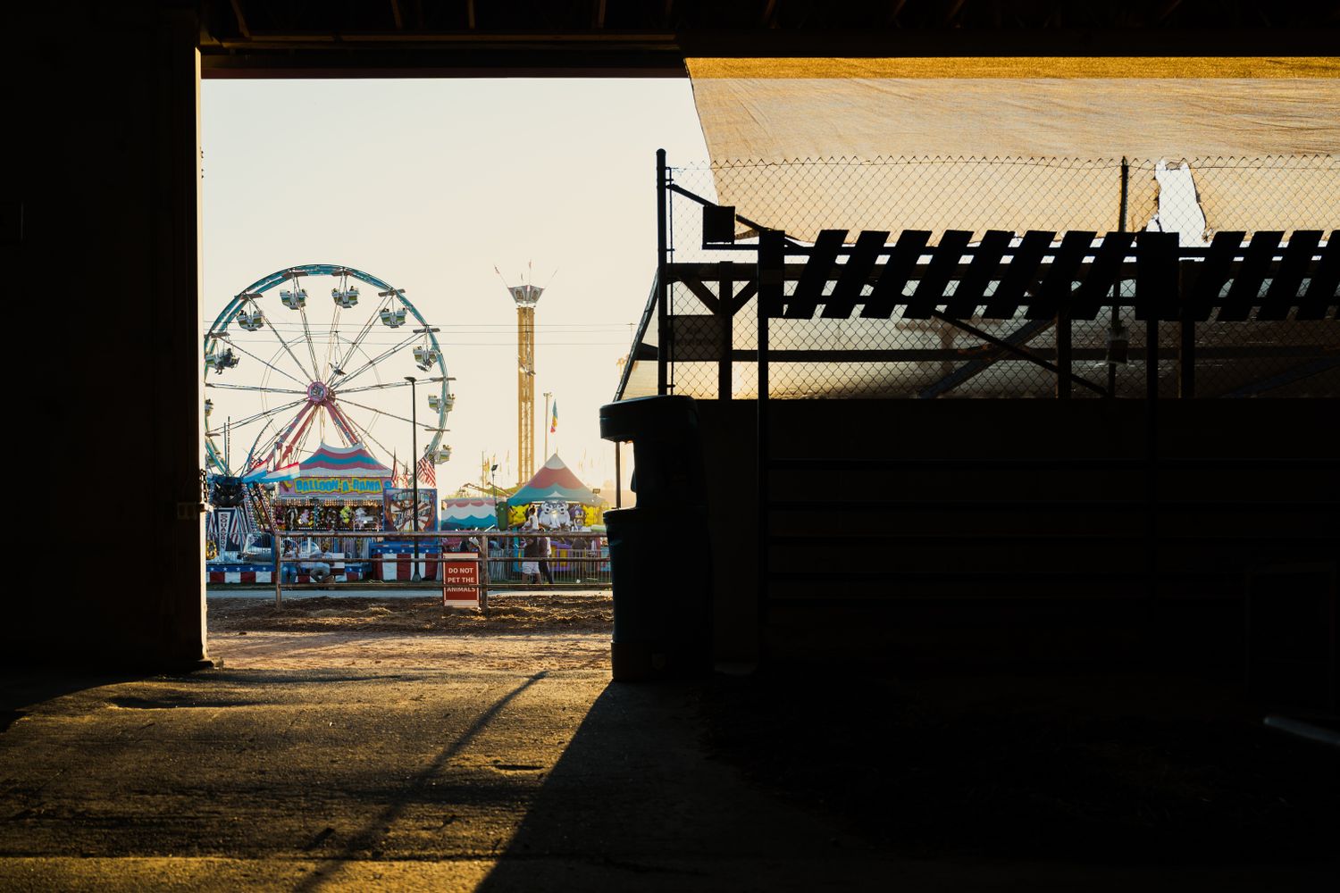 Carnival rides on the illuminated midway at the Greater Gulf State Fairgrounds in Mobile