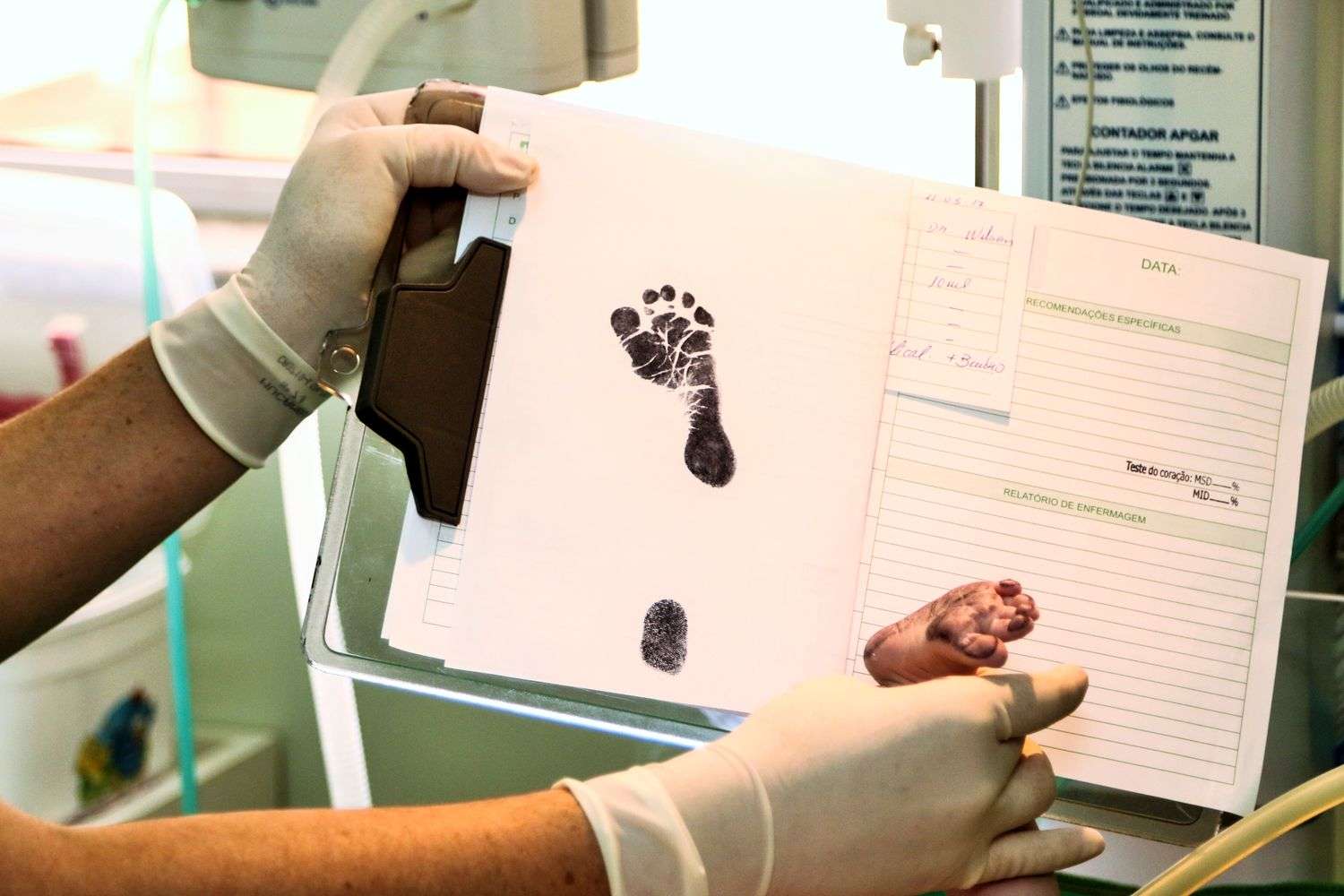 A midwife holds a newborn baby