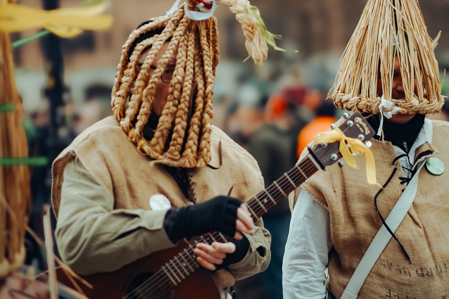 Fiddle and guitar players performing together on stage