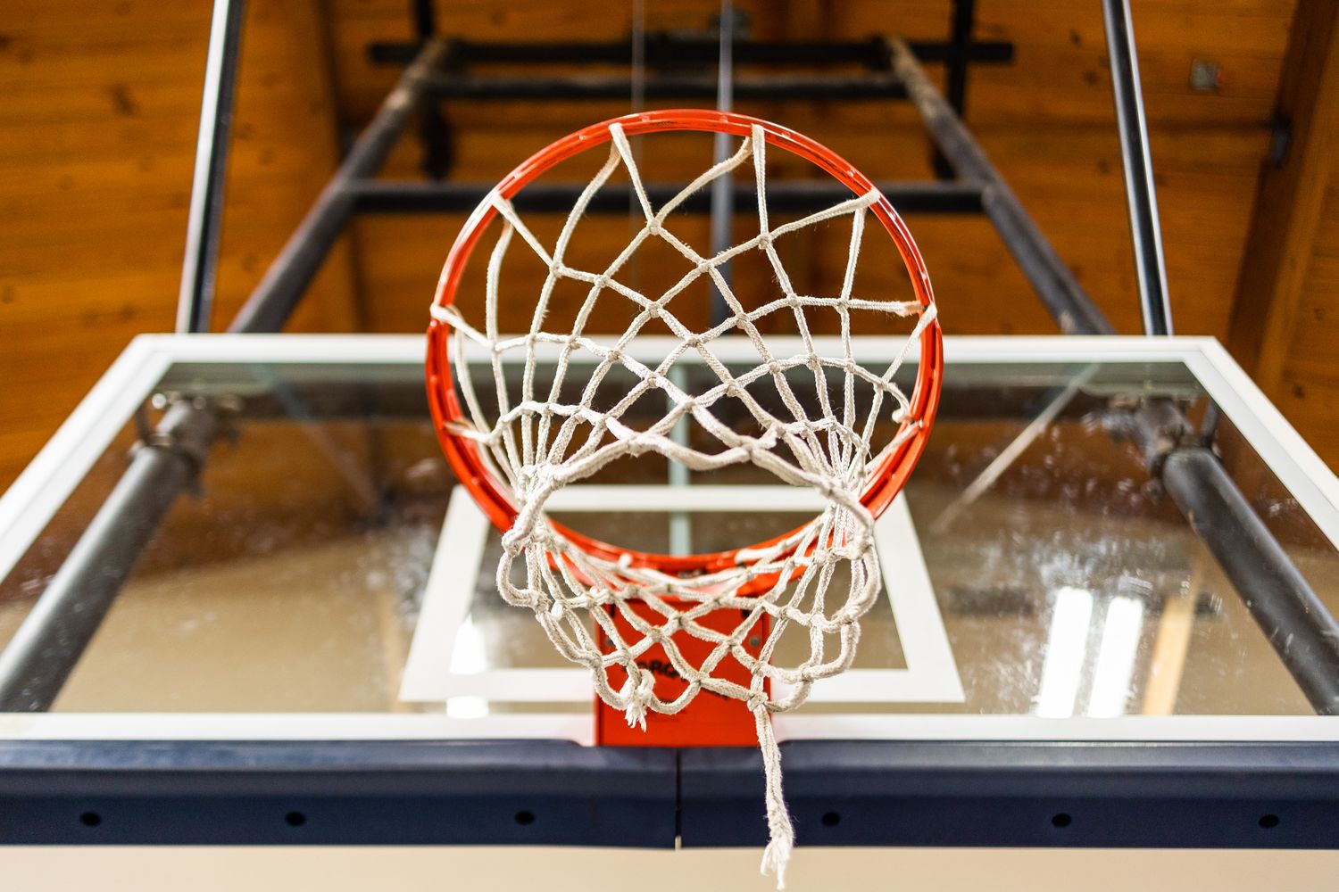 A basketball on the floor of a high school gym during a preseason media day