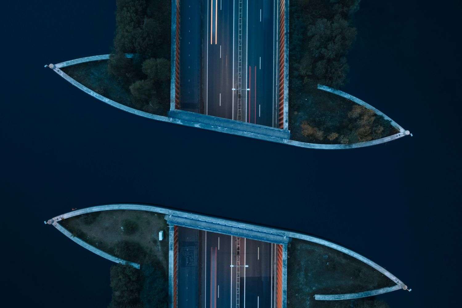 A long highway bridge carrying traffic across open water