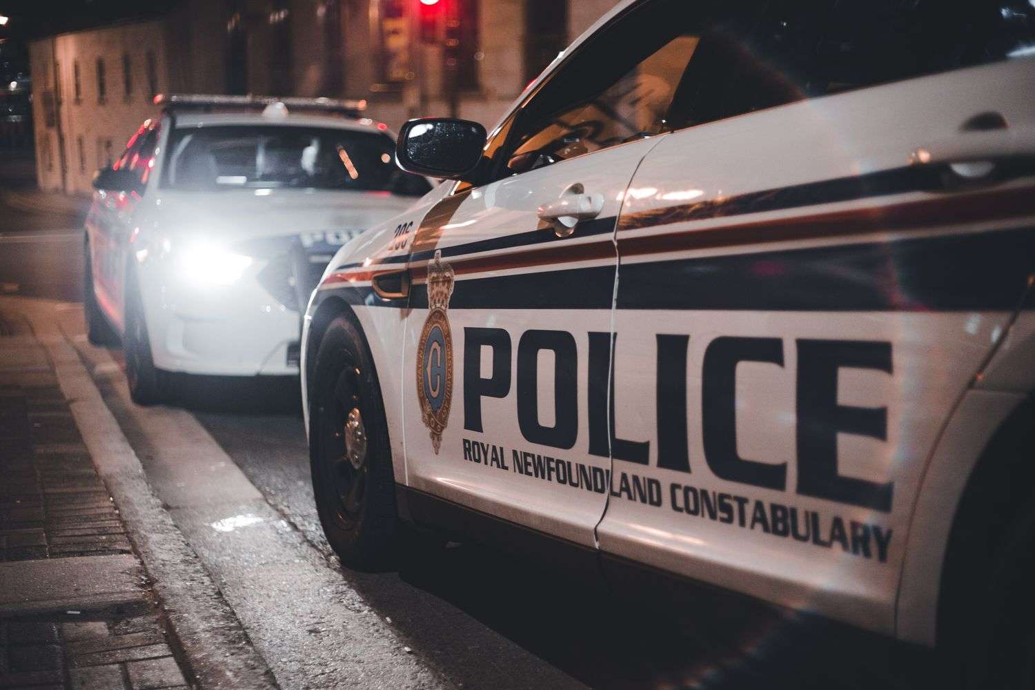 Police patrol car with emergency lights at night