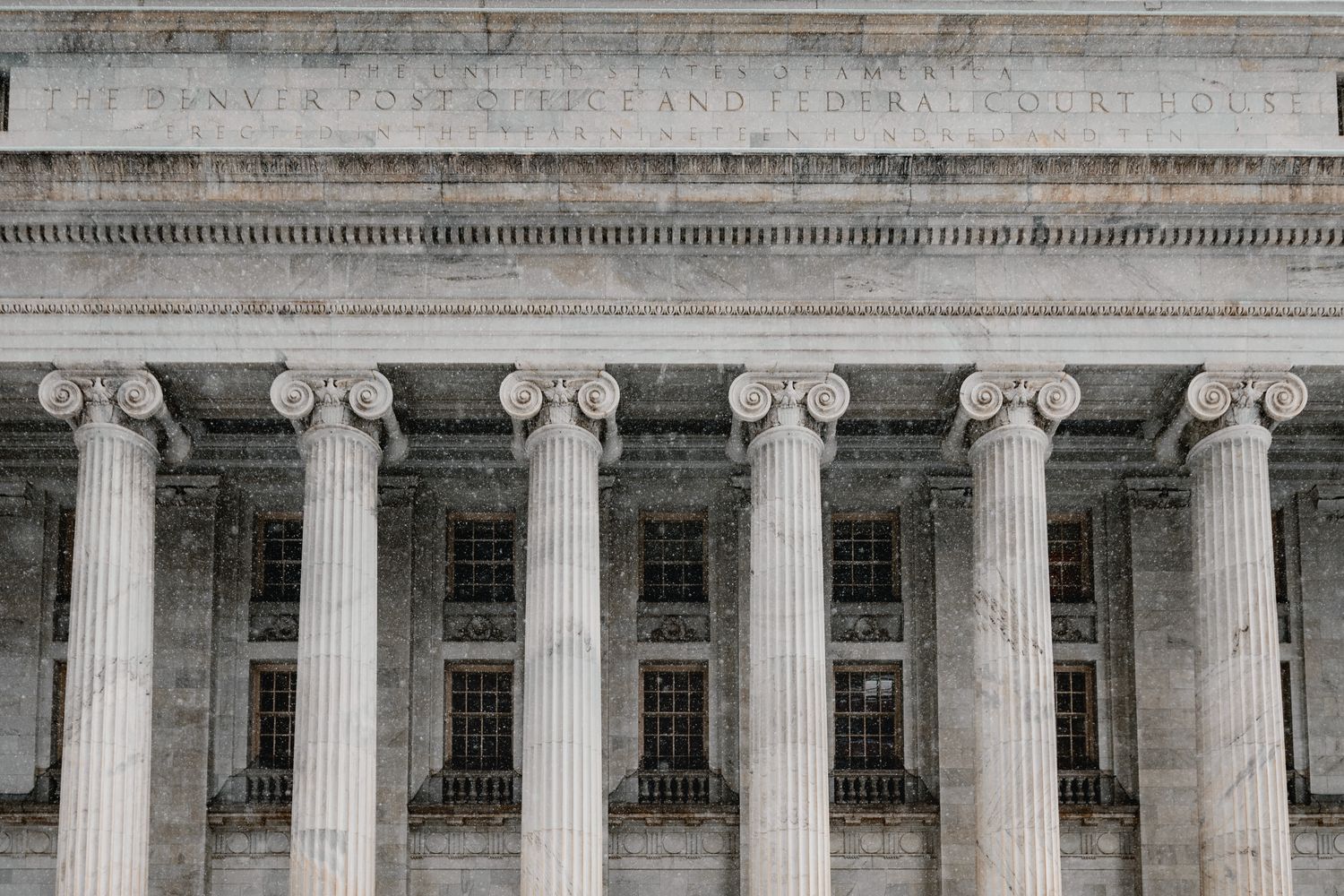 Exterior of a courthouse building with stone columns