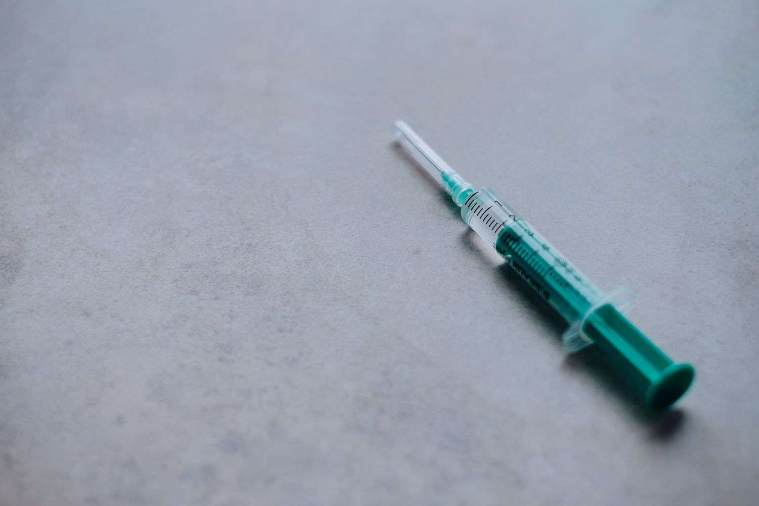 A patient receiving an influenza vaccine injection at a clinic