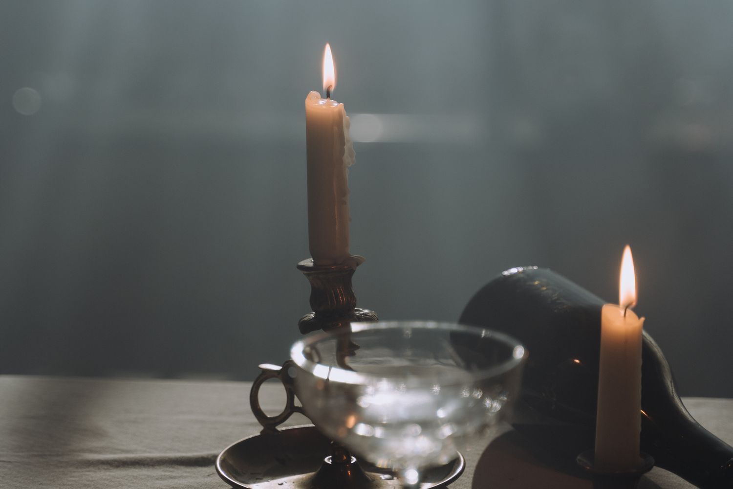 An elegant candlelit dinner table set for a special evening event