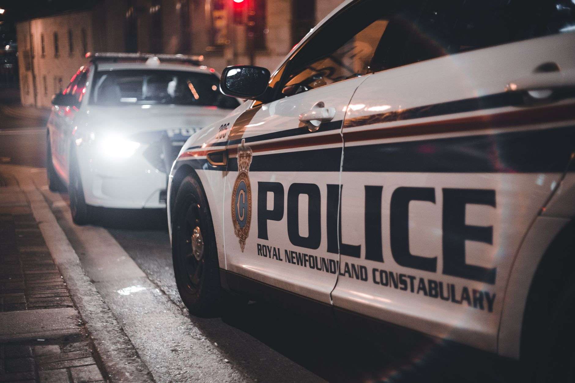 Police vehicle lights illuminated at night