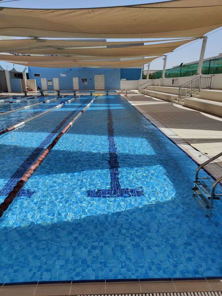 Outdoor public swimming pool with lap lanes