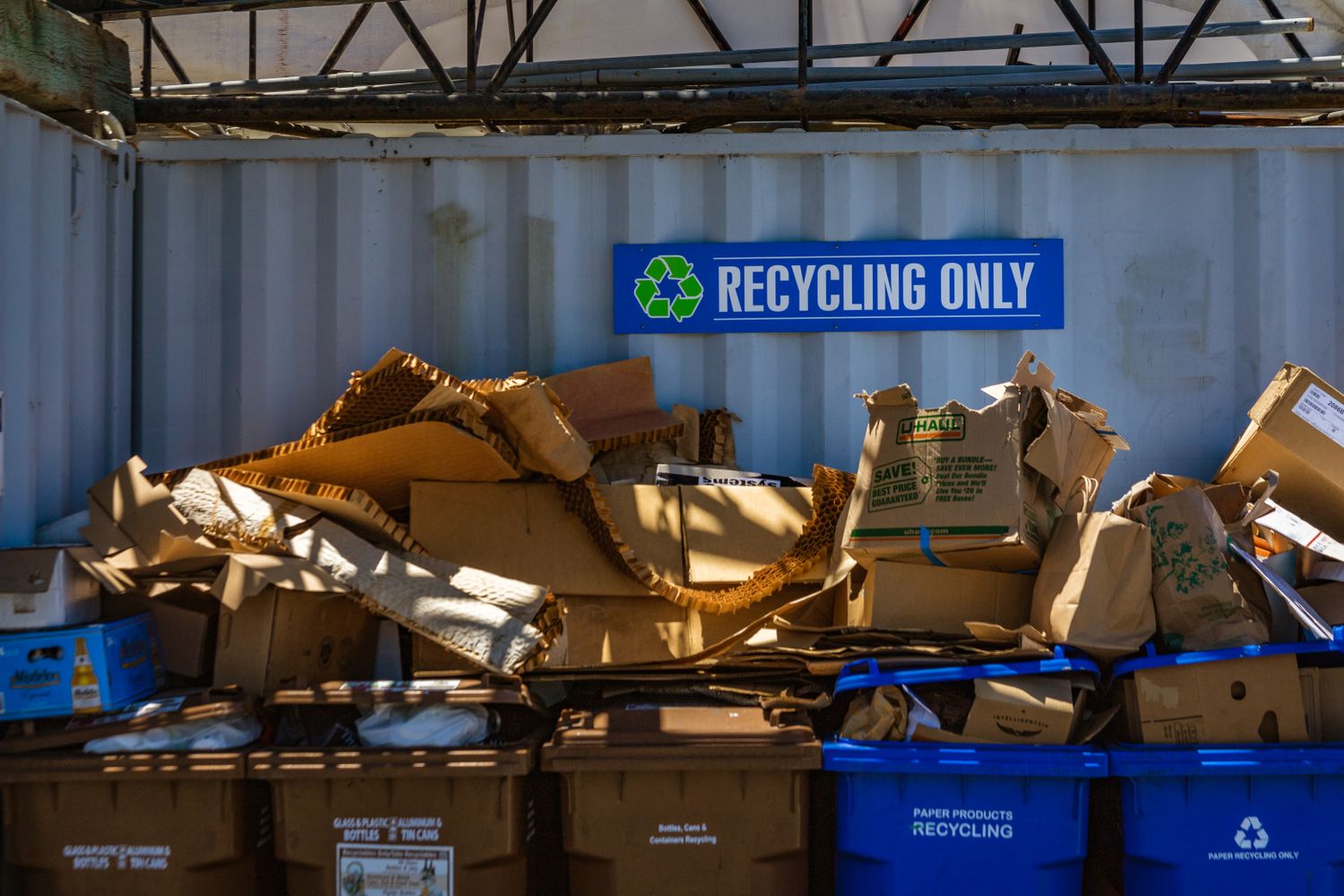 Blue recycling bins at a municipal drop-off recycling center