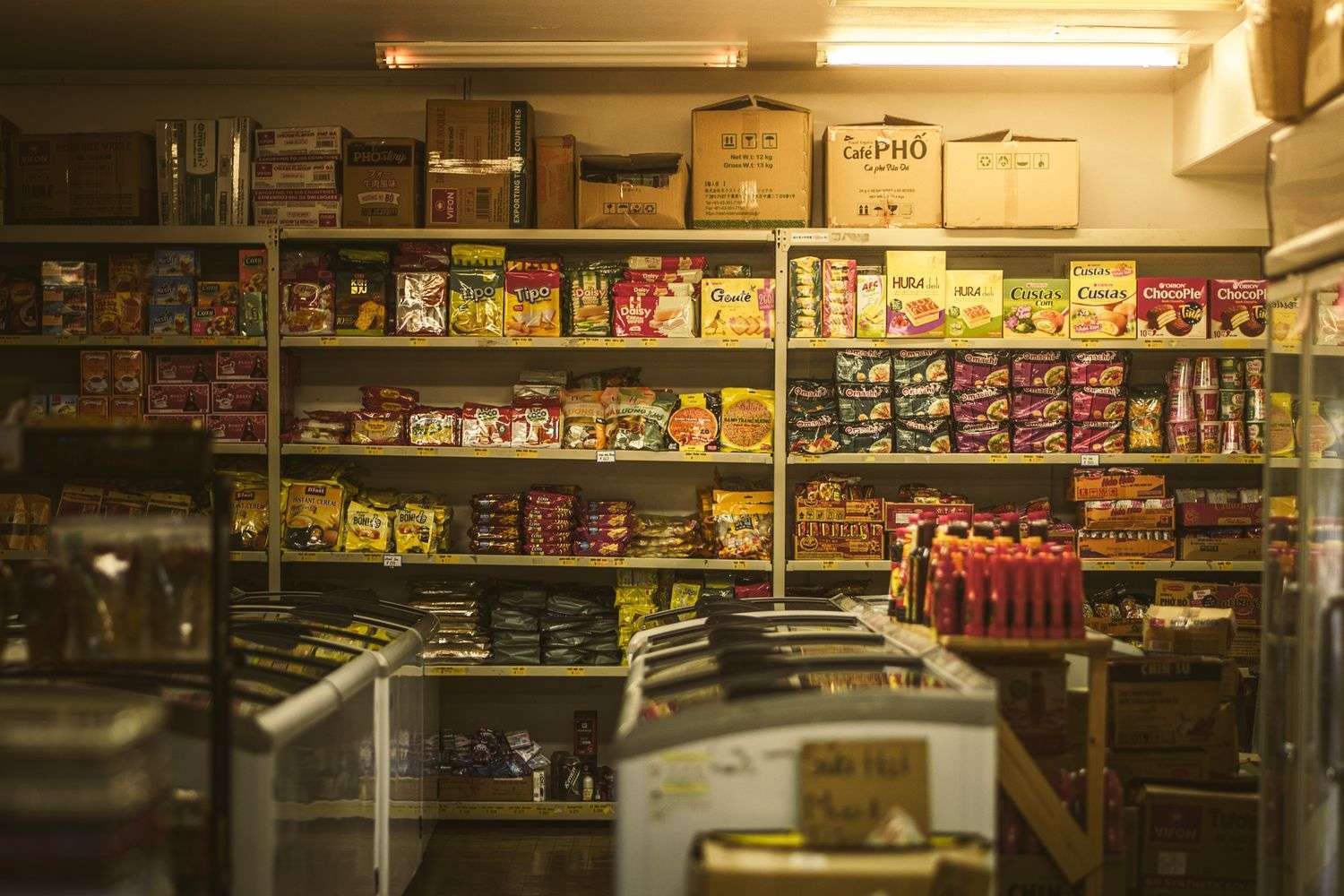 Shelves and an aisle inside a convenience store