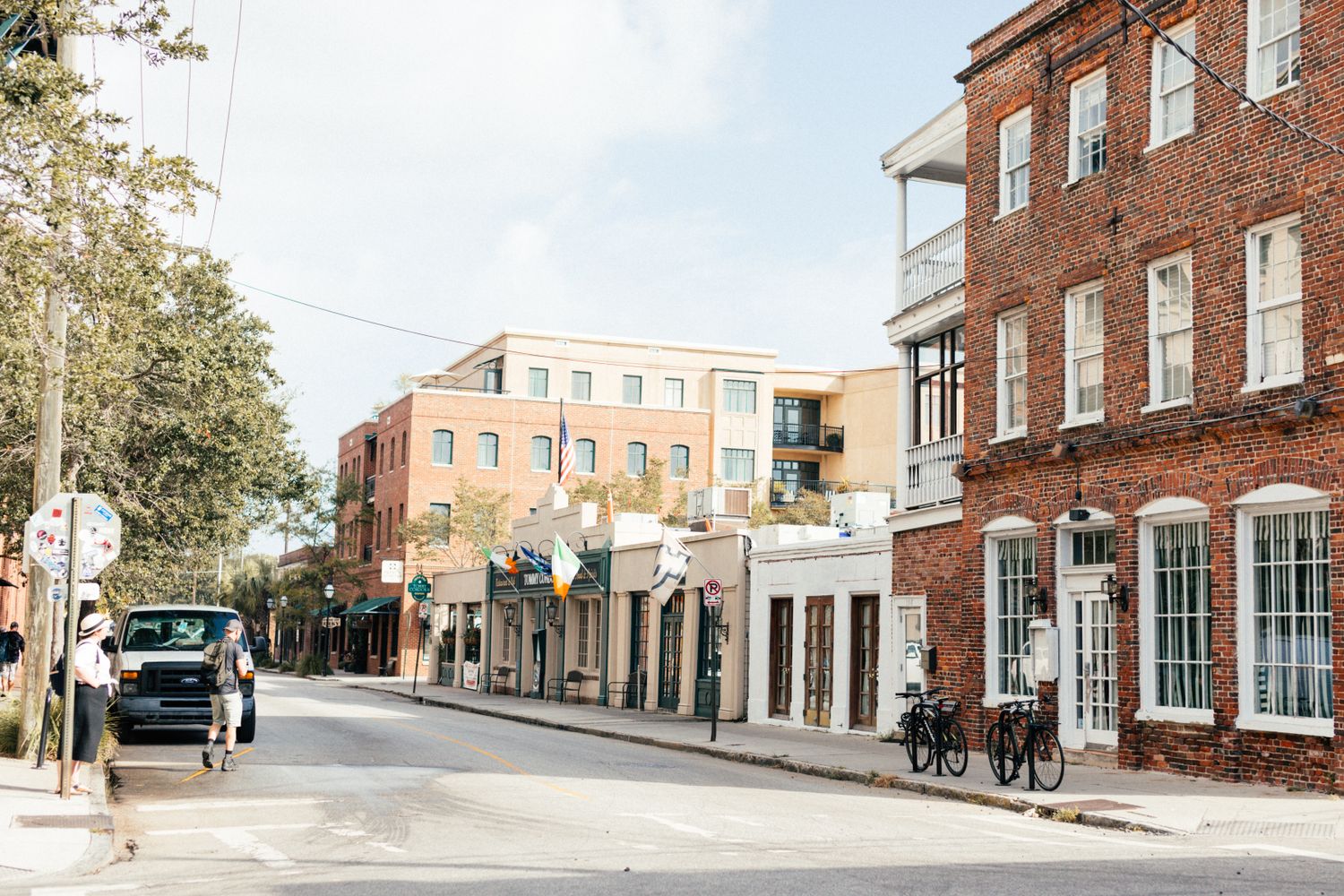 Street view of historic downtown Mobile, Alabama, with storefronts and sidewalks