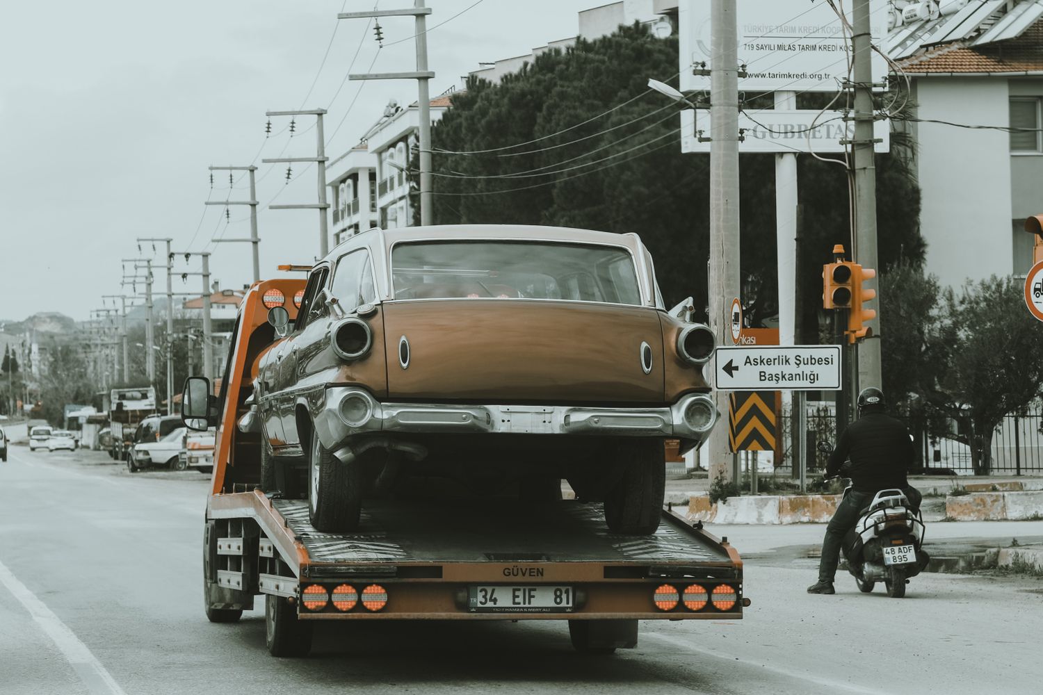 Tow trucks lined up on a city street in Mobile, Alabama