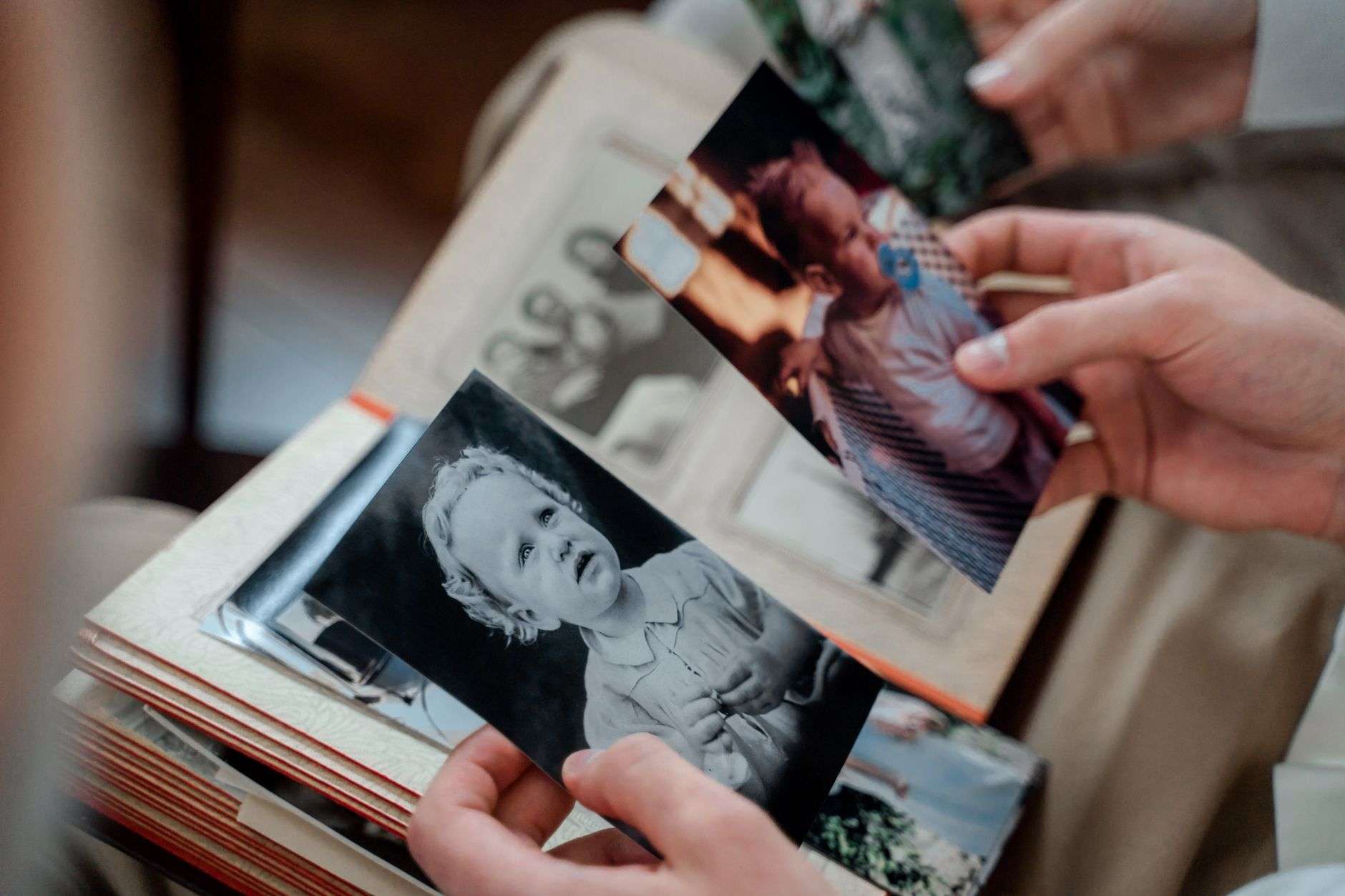 Vintage family photographs and documents laid out on a table