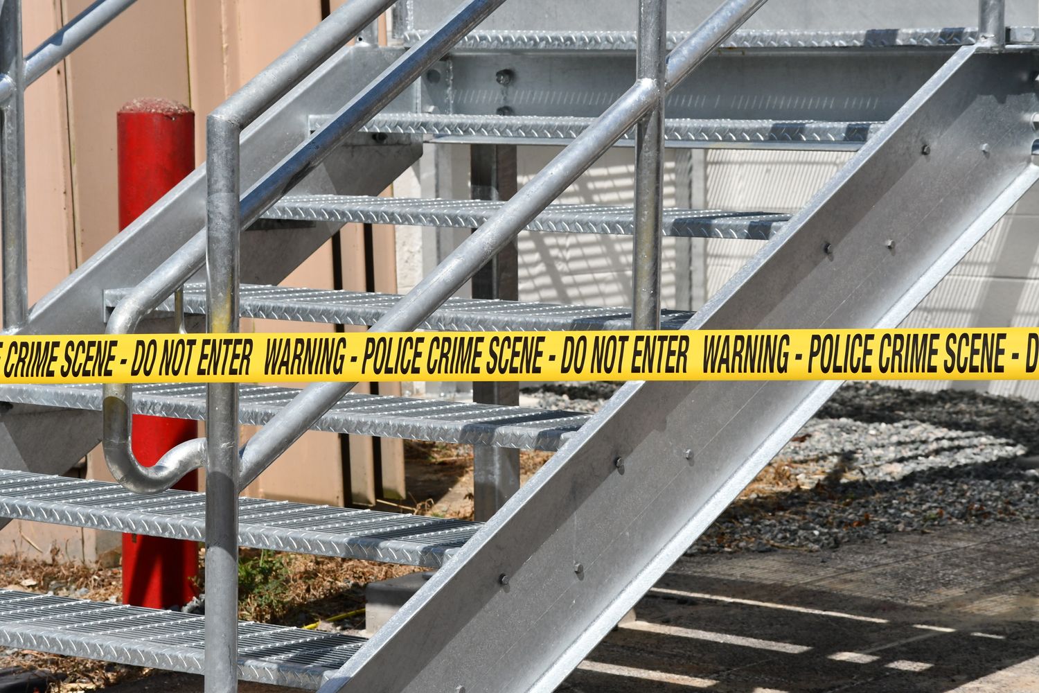 Yellow police caution tape at an investigation scene