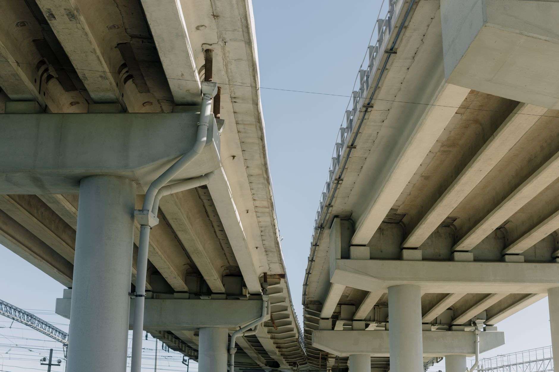A large highway bridge spanning a river, representing a major infrastructure project.