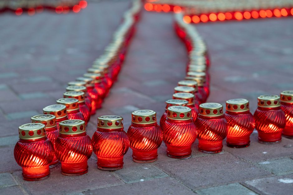 Candles glowing at a community remembrance vigil