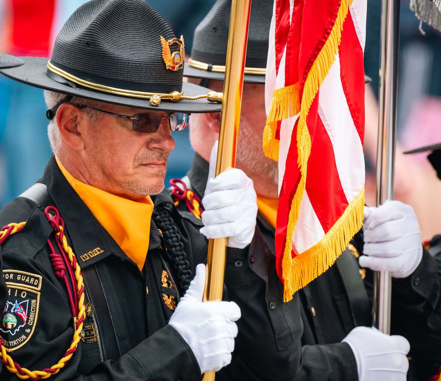 Military honor guard folding an American flag