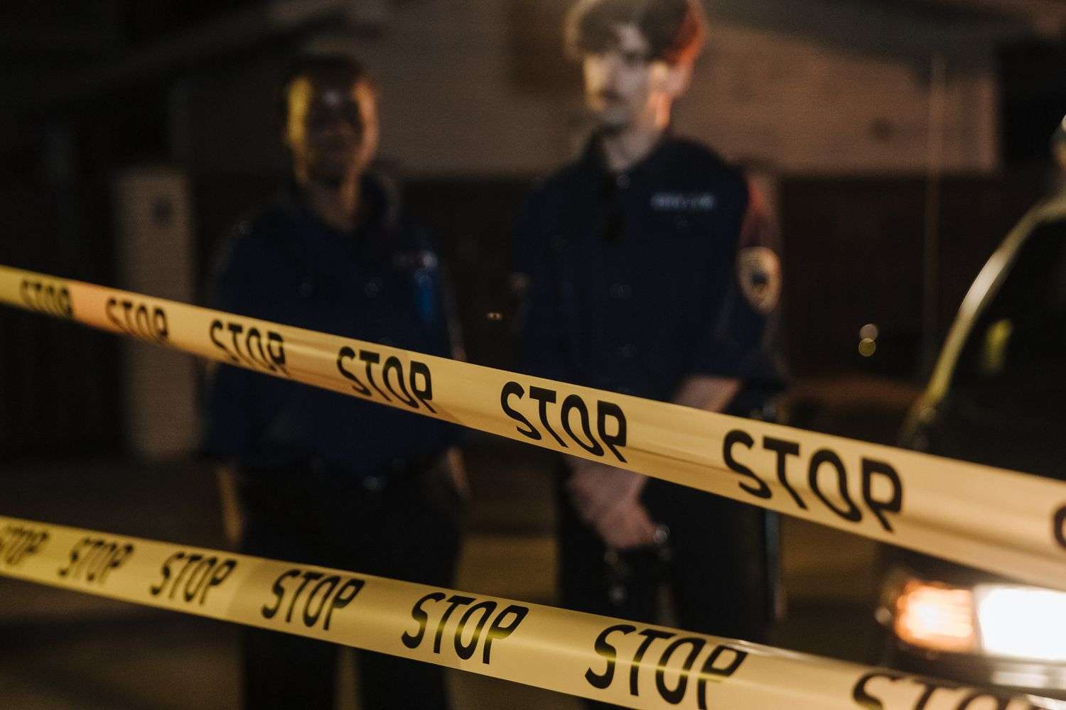 Police lights at a nighttime crime scene