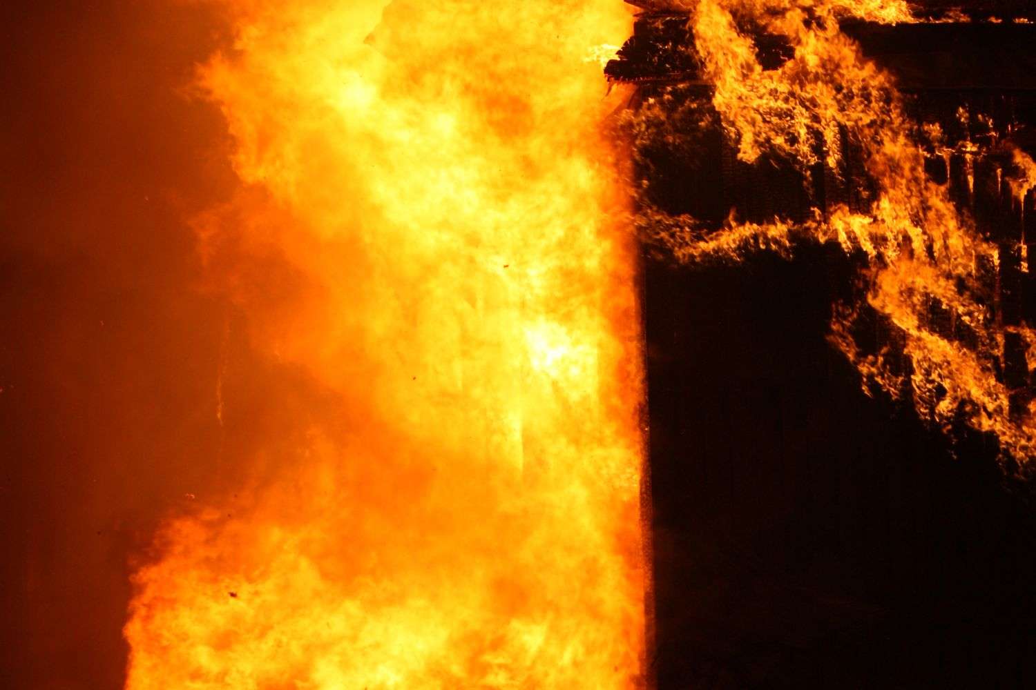 Flames from a building fire at night
