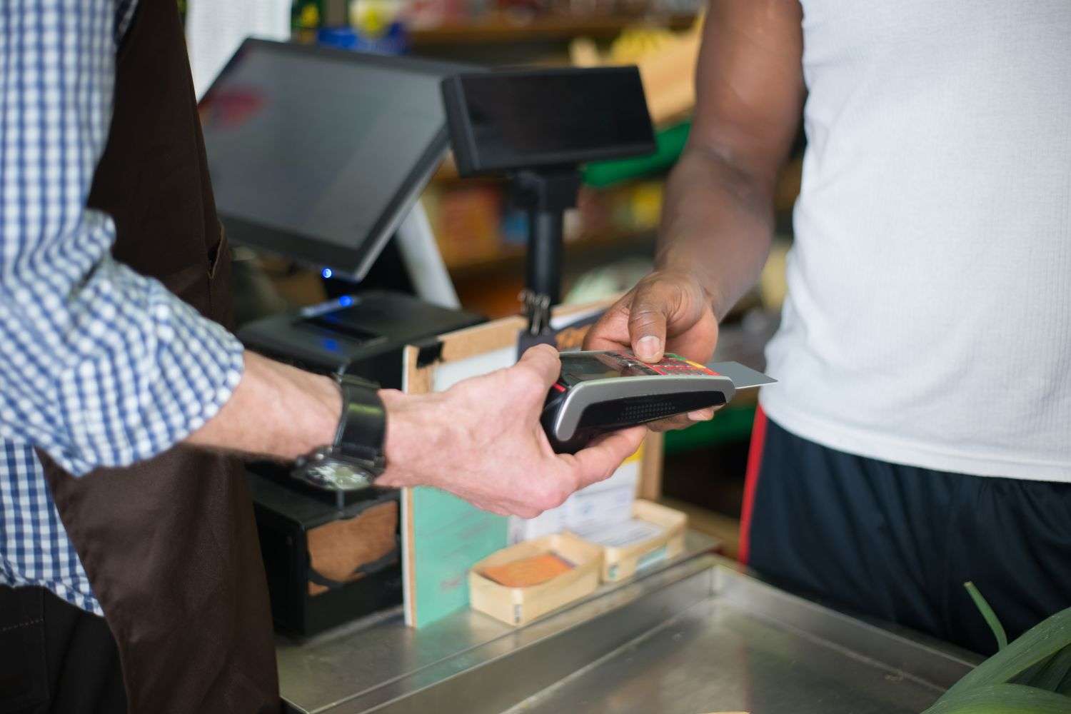 A retail store checkout counter with a cash register