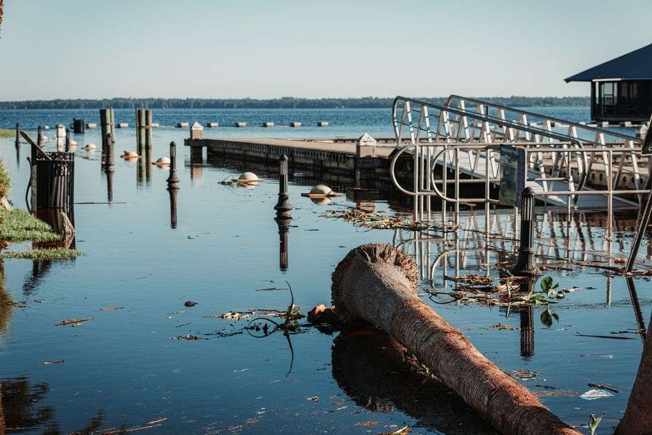 Storm debris along a flooded waterway