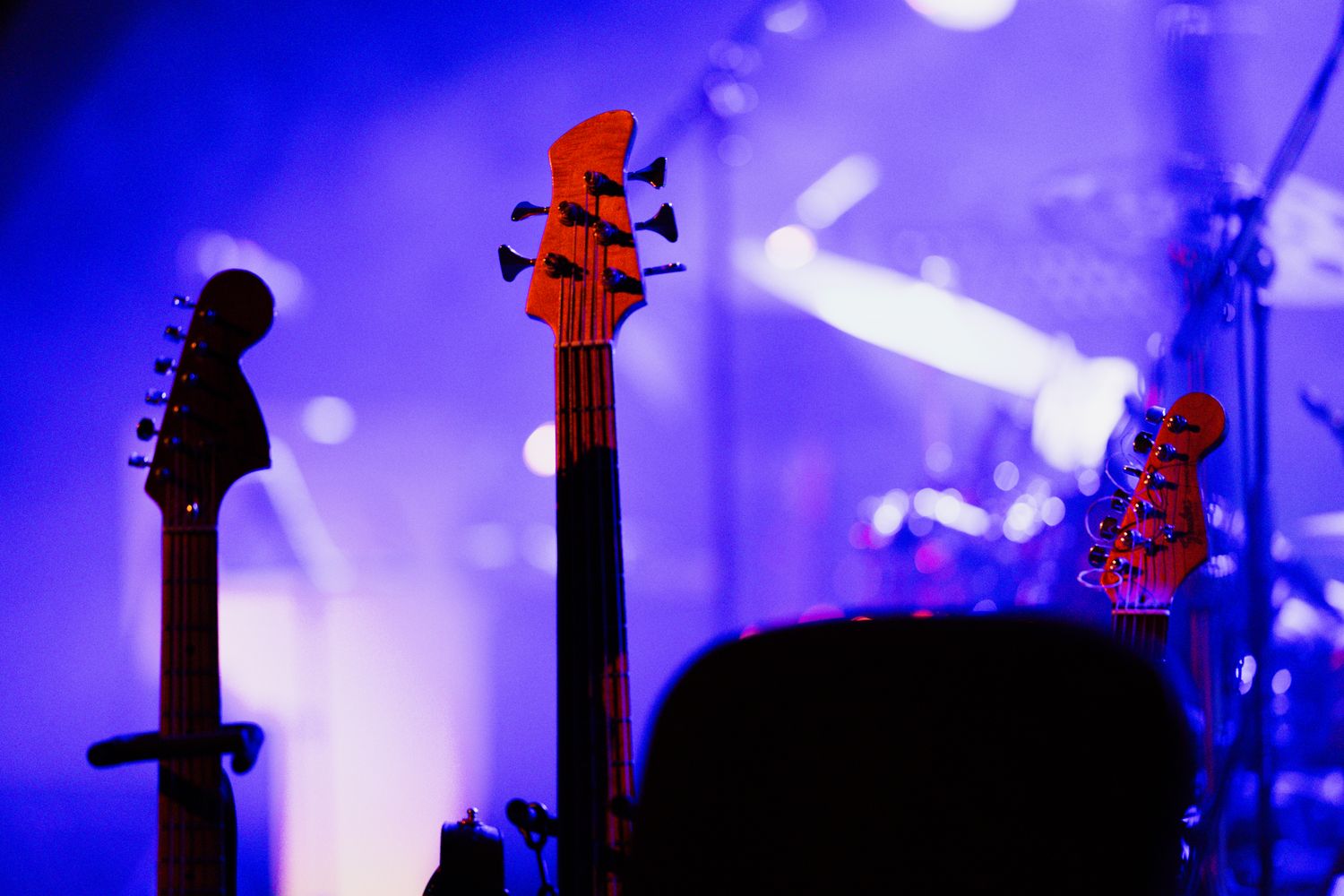 Guitarist performing live rock music on a club stage