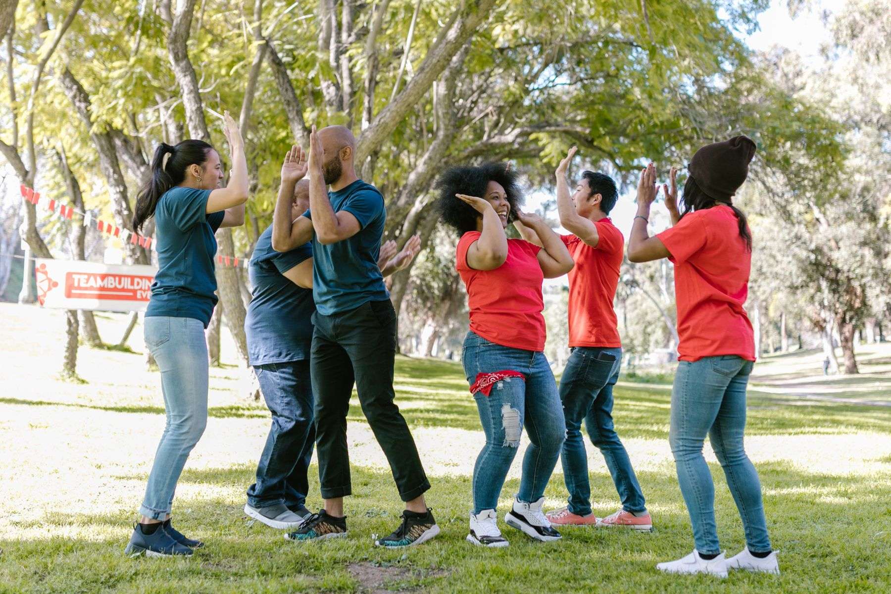 Group of adults enjoying a team-building activity outdoors